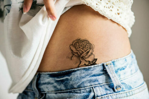 Closeup of lower hip tattoo of a woman